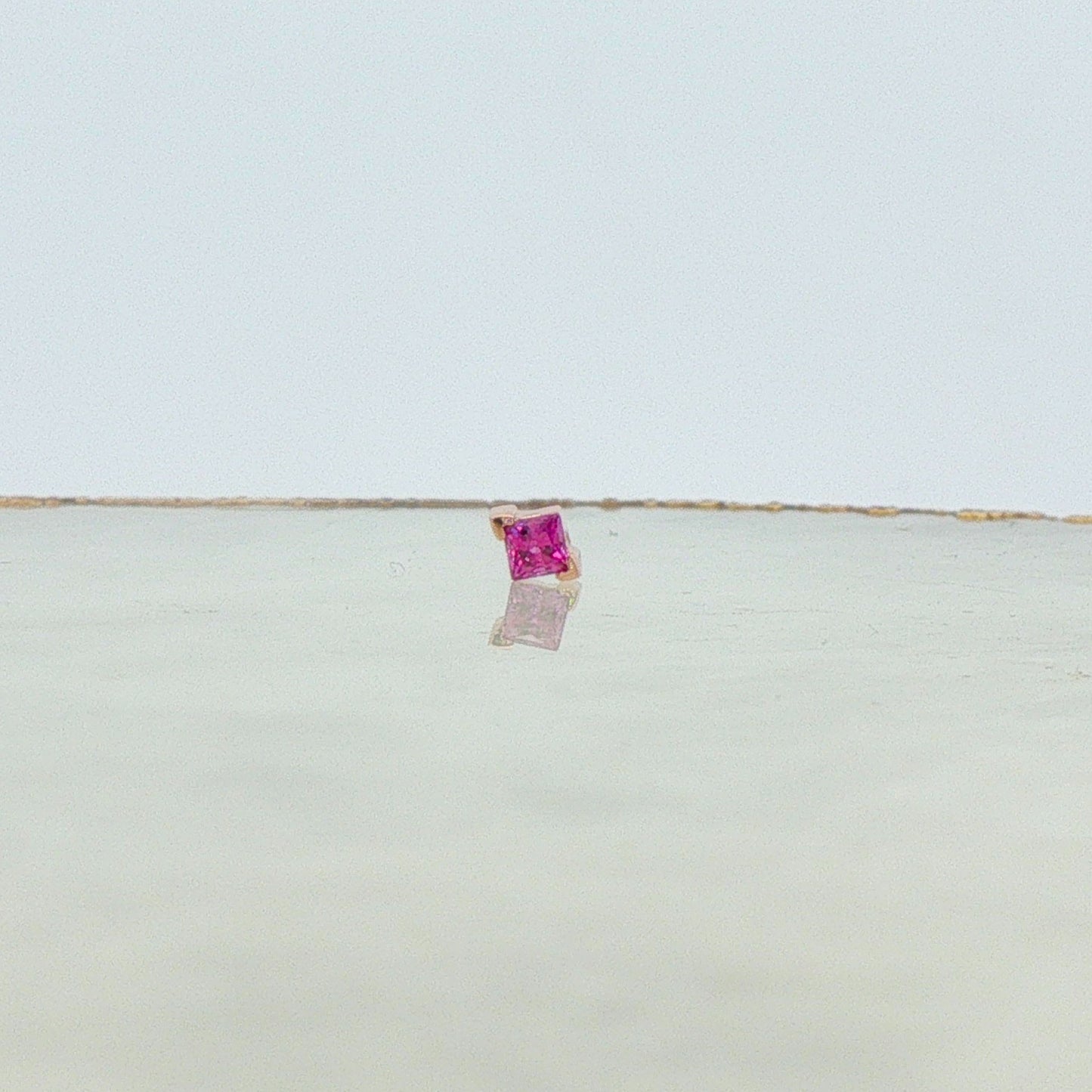 Gold V-Prong Princess Cut Gem